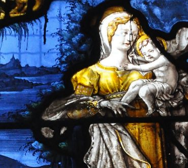 La Vierge et l'Enfant (vers 1530) sur un très beau décor  d'un bleu profond
